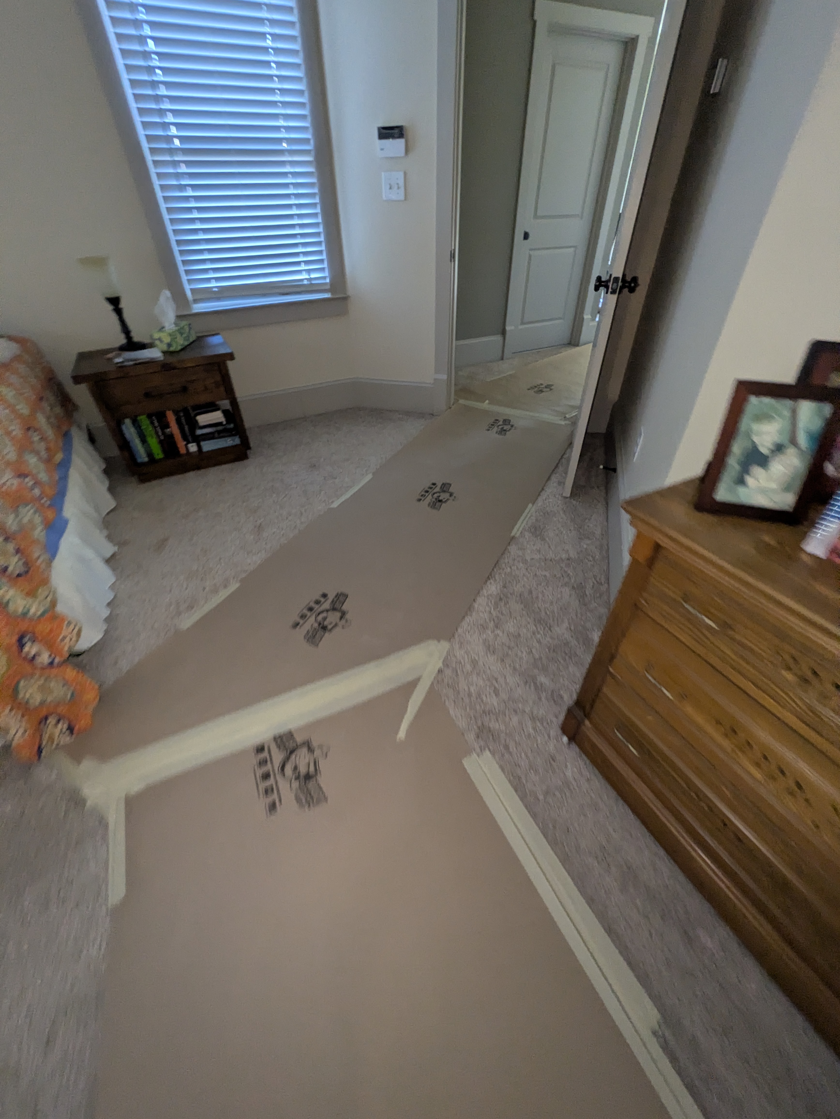 Protected walkway through an Athens cottage during a bathroom gut